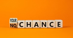 No or your chance symbol. Turned wooden cubes and changed concept words No chance to Your chance. Beautiful orange table orange background, copy space. Business and no or your chance concept.