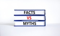Facts vs myths symbol. Concept words Facts vs myths on books on a beautiful white table white background. Business, finacial and facts vs myths concept. Copy space.