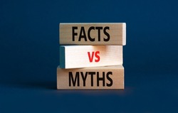 Facts vs myths symbol. Concept words Facts vs myths on wooden blocks on a beautiful grey table grey background. Business, finacial and facts vs myths concept. Copy space.