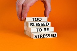 Too blessed to be stressed symbol. Concept words Too blessed to be stressed on wooden blocks. Beautiful orange table orange background. Psychological and too blessed to be stressed concept. Copy space