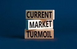 Current market turmoil symbol. Concept words Current market turmoil on wooden blocks on a beautiful grey table grey background. Business, finacial current market turmoil concept. Copy space.