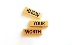 Know your worth symbol. Concept words Know your worth on wooden blocks. Beautiful white table white background. Business and know your worth concept. Copy space.