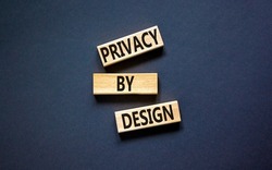 Privacy by design symbol. Concept words Privacy by design on wooden blocks on a beautiful black table black background. Business finacial and privacy by design concept. Copy space.