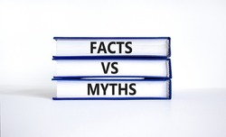 Facts vs myths symbol. Concept words Facts vs myths on books on a beautiful white table white background. Business, finacial and facts vs myths concept. Copy space.