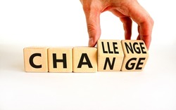 Chance or challenge symbol. Businessman turns wooden cubes and changes the concept word challenge to chance. Beautiful white table white background. Business challenge or chance concept. Copy space.