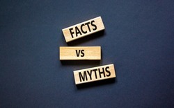 Facts vs myths symbol. Concept words Facts vs myths on wooden blocks on a beautiful black table black background. Business, finacial and facts vs myths concept. Copy space.
