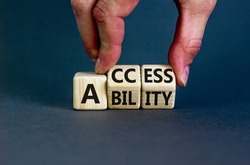 Access and ability symbol. Concept words Access and Ability on wooden cubes. Businessman hand. Beautiful grey table grey background. Access ability and business concept. Copy space.