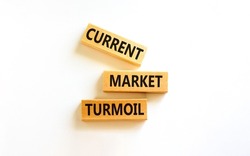 Current market turmoil symbol. Concept words Current market turmoil on wooden blocks on a beautiful white table white background. Business, finacial current market turmoil concept.