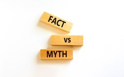 Fact vs myth symbol. Concept words Fact vs myth on wooden blocks on a beautiful white table white background. Business, finacial and fact vs myth concept. Copy space.
