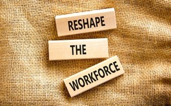 Reshape the workforce and support symbol. Concept words Reshape the workforce on wooden blocks on canvas. Beautiful canvas background. Business reshape the workforce quote concept. Copy space