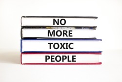 No more toxic people symbol. Concept words No more toxic people on books on a beautiful white table white background. Business, psychological no more toxic people concept.