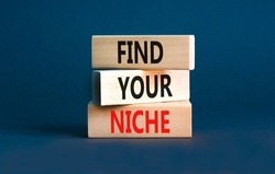 Find your niche symbol. Concept words Find your niche on wooden blocks. Beautiful grey table grey background. Business and find your niche concept. Copy space.