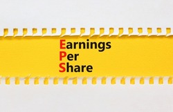 EPS earnings per share symbol. Concept words EPS earnings per share on yellow paper on a beautiful white background. Business and EPS earnings per share concept. Copy space.