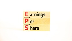 EPS earnings per share symbol. Concept words EPS earnings per share on wooden blocks on a beautiful white background. Business and EPS earnings per share concept. Copy space.
