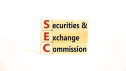 SEC securities and exchange commission symbol. Concept words SEC securities and exchange commission on wooden blocks on beautiful white background. Business SEC securities exchange commission concept.