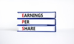 EPS earnings per share symbol. Concept words EPS earnings per share on books on a beautiful white background. Business and EPS earnings per share concept. Copy space.