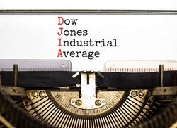 DJIA Dow Jones industrial average symbol. Concept words DJIA Dow Jones industrial average on typewriter on beautiful white background. Business DJIA Dow Jones industrial average concept. Copy space