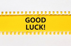 Good luck symbol. Concept words Good luck on beautiful yellow paper. Beautiful white paper background. Business, motivational good luck concept. Copy space.