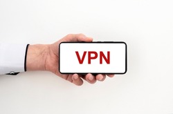 man hand holding phone with text acronym VPN Virtual Private Network