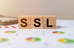 SSL, security certificate for web site written on wooden cube blocks.