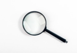 Magnifying glass or lens on white, top view.