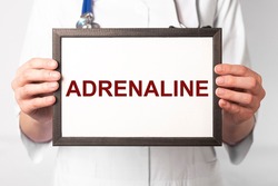 Adrenaline hormone, word on paper. High quality photo