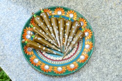 Henna/Mehendi Cone Placed in Decorated Plate in India. Mehndi Cone in Wedding / Marriage