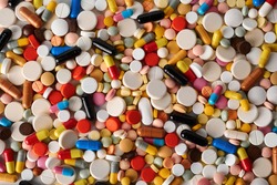 top view of a large number of colored tablets, pills and capsules