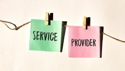 SERVICE PROVIDER text words inscription on yellow sticker note on white wall or table.