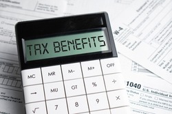 TAX benefits word on calculator. Business and tax concept. Time to pay tax in year.