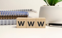 WWW lettering on wooden cubes on a light background