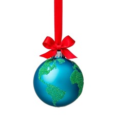 Globe Christmas ornament with red bow isolated on white. Peace on Earth, eco friendly or winter travel concept.