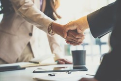 Business partnership meeting concept. Image businessman s handshake. Successful businesswomen handshaking after a good deal.