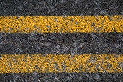 Double Yellow Line On Old Asphalt Road texture and background