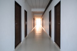 Long empty apartment corridor with vintage style.