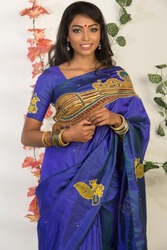 beautiful young woman wearing saree, indoor lighting, ethnic look