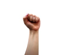Woman hand with long manicured nails raised up with fingers clenched in palm in plain background. Female clenched fist as symbol of woman power. Concept of strength of girl and her struggle for rights
