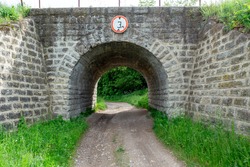 Stone tunnel for transport, under the railway