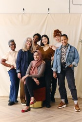 Portrait of mixed age range multi ethnic women smiling in celebration of International Women's Day, Embrace Equity