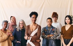 International Women's Day portrait of confident multiethnic mixed age range women looking towards camera, Embrace Equity