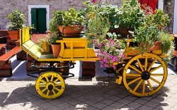 Garden wagon, in the city centre of Vodice. Summer season. Wooden wagon