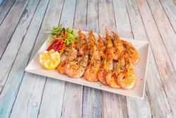 Tray of great grilled fried prawns with spurts of lemon, garlic and parsley, to lick your fingers