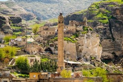 Hasankeyf ancient city minaret full of caves and cliffs