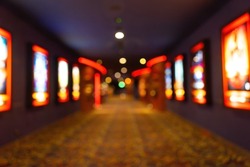 Movie theater entrance interior blur image use for background of business and cinema concept. Abstract blurred image of lobby of movie theater in Vietnam.
