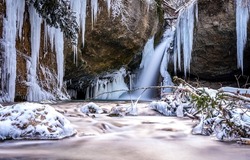 Frozen waterfall in winter scene. Frozen waterfall icilces. Icicles of frozen waterfall