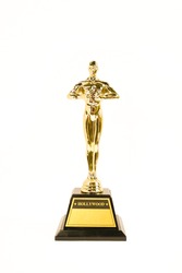 Oscar Academy award or Hollywood golden trophy isolated on a white background. Success and victory concept.