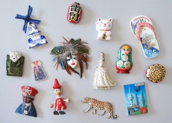 Magnet collection. Souvenir fridge magnetic collection from all around the world. Japanese text on the red lantern meaning god of thunder.
