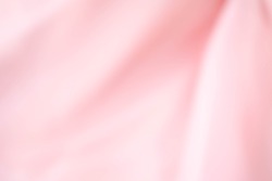 pink fabric textures background ,fabric uneven. abstract blur of pink fabric for Valentine's background. pink silk fabric defocused for background