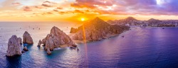 Aerial panoramic view of the Cabo San Lucas, Mexico marina and the rock formations at Lands End. the southernmost tip of the Baja California peninsula, where the Sea of Cortez meets the Pacific Ocean