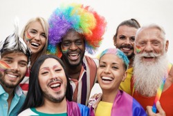 Cheerful multiracial people from different generations at gay pride parade - Concept of lgbt and homosexual love